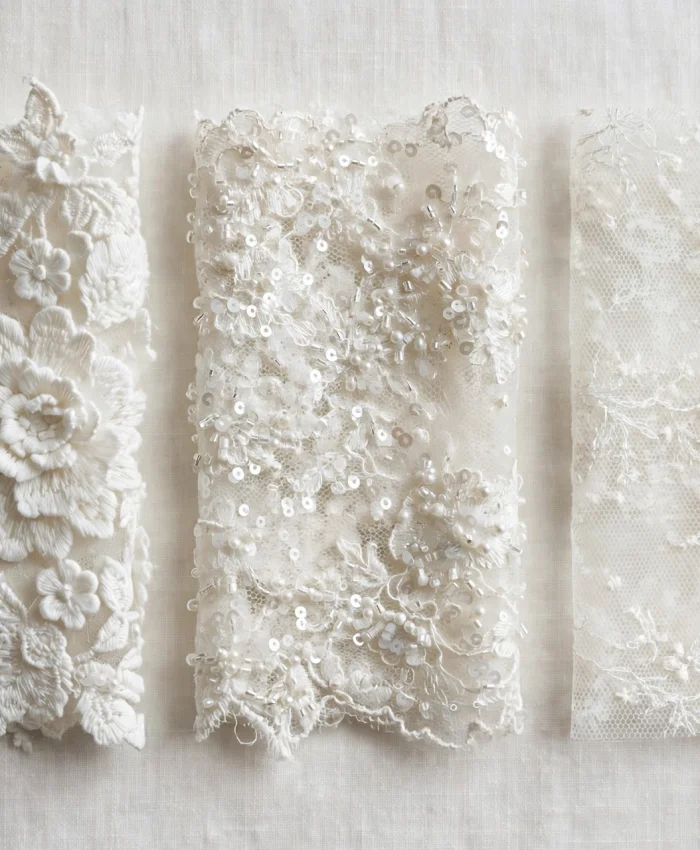 Three lace swatches: raised 3D floral lace, beaded sequin lace, and delicate embroidered mesh lace